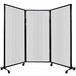 A Versare clear poly room divider on wheels.