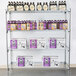 A Metro Super Erecta wire shelf with bottles and boxes on it.