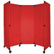 A red rectangular Versare MP10 folding partition with black corners and wheels.