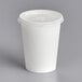 A Choice white paper cold cup with a flat lid.