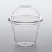 A clear plastic cup with a dome lid.