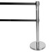 A chrome stanchion with black tape and a silver base.