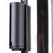 A chrome Aarco crowd control stanchion with black retractable belts.