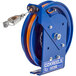 A blue Coxreels static discharge cable reel with orange wires on a stainless steel cable.