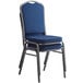 A blue Lancaster Table & Seating banquet chair with a silver frame.