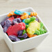 A bowl of Albanese Gummi Frogs on a counter.