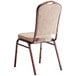A Lancaster Table & Seating tan fabric banquet chair with a copper vein frame.