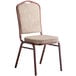 A Lancaster Table & Seating tan fabric banquet chair with a cushion and a copper vein frame.