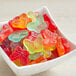 A bowl filled with colorful Albanese Mini Gummi Butterflies.