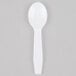 A white plastic Royal Paper taster spoon with a black handle.