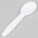 A Royal Paper white plastic taster spoon on a gray surface.