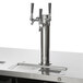 A black Beverage-Air triple tap kegerator on a counter with a stainless steel wine tap.