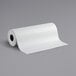 A Lavex white paper roll on a gray surface.