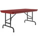 A red rectangular Correll folding table with black pedestal legs.