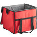 A red nylon cooler bag with black handles.