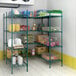 A Regency green wire shelving unit with food on the shelves.