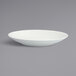 A close up of a Fortessa Ilona bright white coupe china bowl.