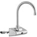 A silver Waterloo wall mount hands-free sensor faucet with a gooseneck spout and black button.