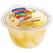 A white plastic container of Premium Fruit Mix in natural juice.