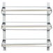 A white metal horizontal wall rack with three shelves and metal bars.
