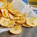 A pile of Goya garlic plantain chips on a table.