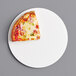 A slice of pizza on a white 8" corrugated pizza circle.