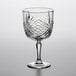 An Arcoroc gin and tonic glass with a diamond pattern.