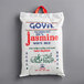 A white Goya bag of Thai white jasmine rice with red and blue text.