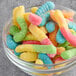 A bowl of colorful Albanese Mini Gummi Worms.