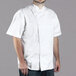 A man wearing a white short sleeve Chef Revival chef jacket.