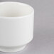 A white Homer Laughlin Pristine Ameriwhite china bowl on a gray surface.