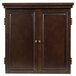 An American Legend Chelsea dartboard cabinet in brown with gold knobs.