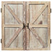 An American Legend barnwood dartboard cabinet with two wooden doors with metal handles.