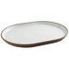 A white oval platter with a raised brown rim.