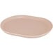 A Cal-Mil blush melamine oval tray with raised rim and a pink oval plate.