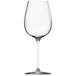 A close-up of a clear Chef & Sommelier Villeneuve wine glass with a long stem.