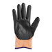 A pair of black and orange rubber gloves, one orange and one black.
