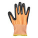 A close up of an orange and black Mercer Culinary Millennia level cut-resistant glove.