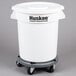 A white round Continental Huskee ingredient storage bin with a flat top lid on wheels.