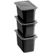 A stack of three black Vigor plastic food pans with secure sealing covers.