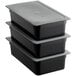 Three black Vigor plastic food pans with secure sealing lids.