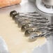 A row of dough cut with an Ateco stainless steel pastry cutter.
