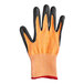 A close-up of a black and orange Mercer Culinary Millennia food processing glove.