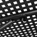 A close up of the metal structure of a Lancaster Table & Seating Harbor Black outdoor table with a bolt.