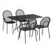 A Lancaster Table & Seating Harbor black rectangular outdoor table with chairs.
