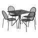 A black Lancaster Table & Seating outdoor table with four chairs.