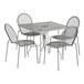A Lancaster Table & Seating outdoor table and chair set with a square wire mesh top and ornate legs.