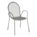 A Lancaster Table & Seating metal arm chair with a wire mesh back.