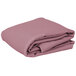 A stack of folded pink Intedge rectangular table covers on a white background.