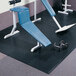 A gym room with gym equipment on a black Cactus Mat outside corner weight room mat.